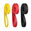 A set of three resistance bands in yellow, red, and black, coiled neatly with a logo on each band.