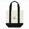 A mini canvas tote in cream and black with handles and a logo on the front.