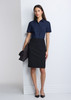 A navy short sleeve shirt paired with a black skirt, displayed on a model against a grey backdrop.