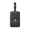 A black luggage tag tracker with a strap, featuring a logo on the front and a power button.