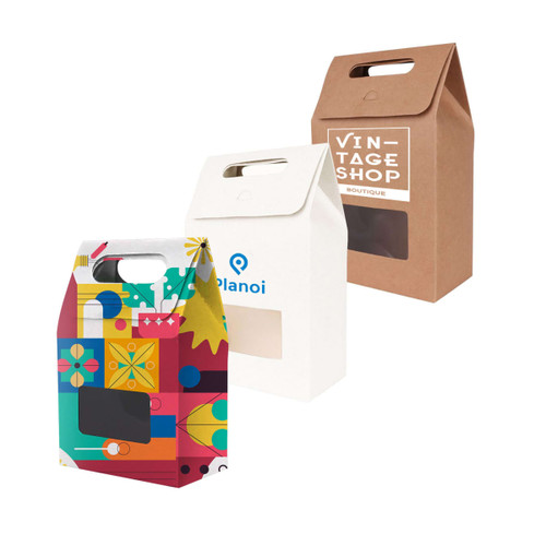 Three die cut handle bags with windows in various designs: one colourful, one white, and one brown kraft.