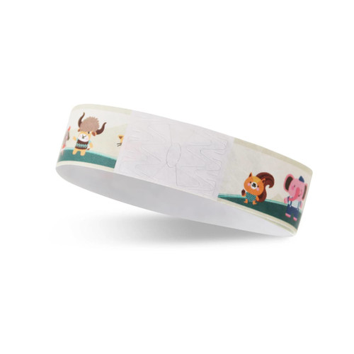 A colourful Tyvek wristband featuring animated characters, designed for events, with a noticeable logo.