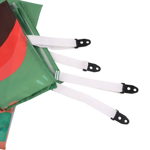 An outdoor blanket in vibrant green with red design elements, featuring white securing straps.
