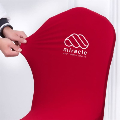 A fitted banquet chair cover in vibrant red, being pulled to showcase its stretch material, featuring a logo.