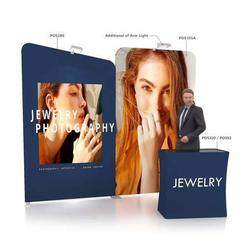 Inclined portable exhibit display wall featuring vibrant images and a dark blue colour scheme, includes a branding element and an arm light.