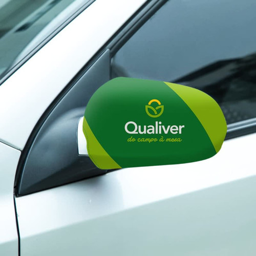 A green and yellow car mirror cover with a logo, designed for sedans, positioned on a silver car.