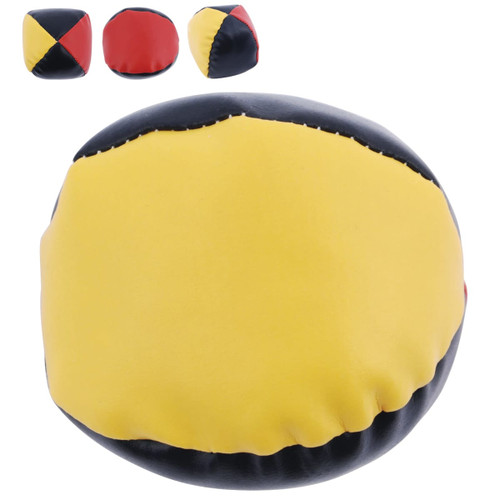 A hacky sack featuring a yellow, black, and red design with a smooth surface. It has a rounded shape and a visible logo.