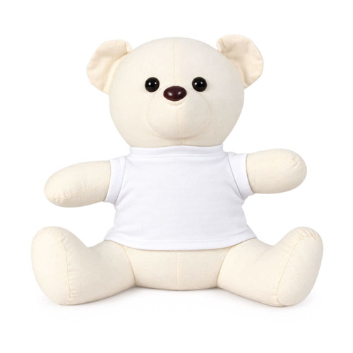 A plush calico bear in cream, featuring a white t-shirt and button-like eyes. It has a simple, friendly design.