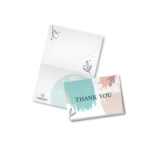 A thank you card with a pastel design, featuring leaves and abstract colour blocks. It comes with a matching envelope.