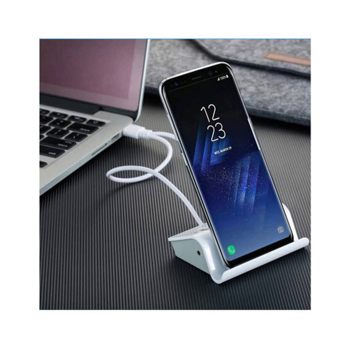 A white Media Hub Stand with a smartphone propped up, connected to a laptop via a USB cable.