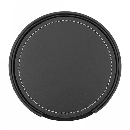 A circular black leather coaster with white stitching, part of a set of six. Includes a holder.