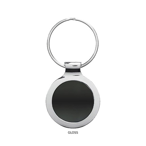 A glossy silver key ring featuring a round, reflective disc in the centre.