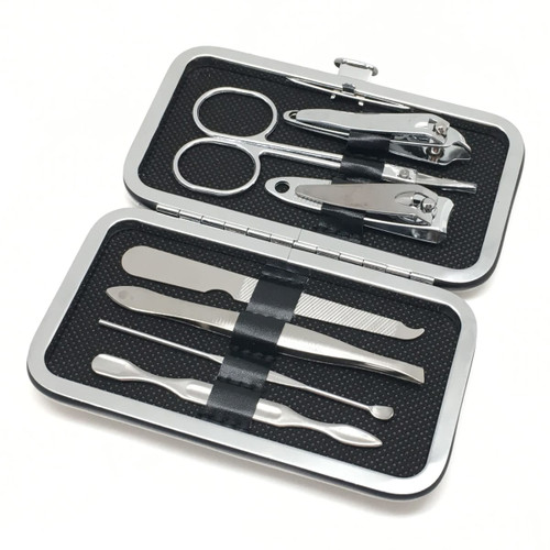 A silver manicure set contains scissors, nail clippers, tweezers, and other grooming tools in a compact case.