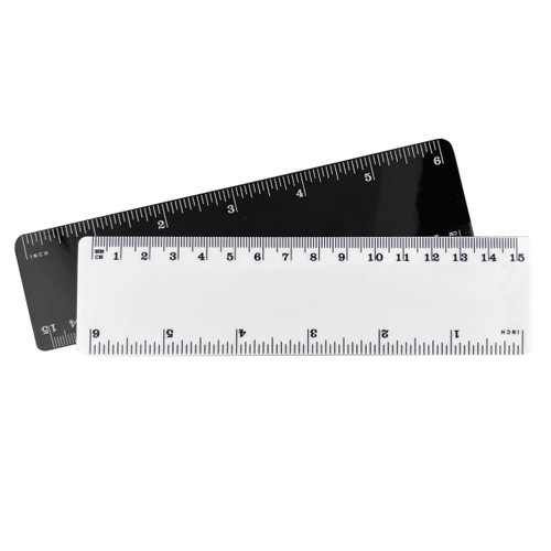 A 15cm plastic ruler in white and black, featuring measurement markings on both sides and a logo.