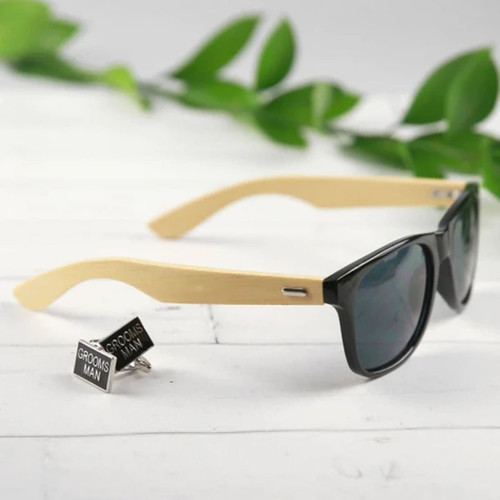 Bamboo Raybeam Premium Sunglasses with black lenses and bamboo arms, accompanied by silver 'Groomsman' cufflinks.