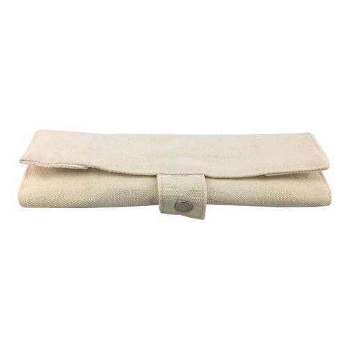 A bamboo utensils set wrapped in a beige fabric case with a button closure. Includes various cutlery pieces.