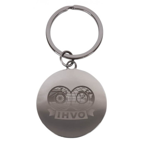 A silver round keychain featuring a logo, attached to a metal ring.