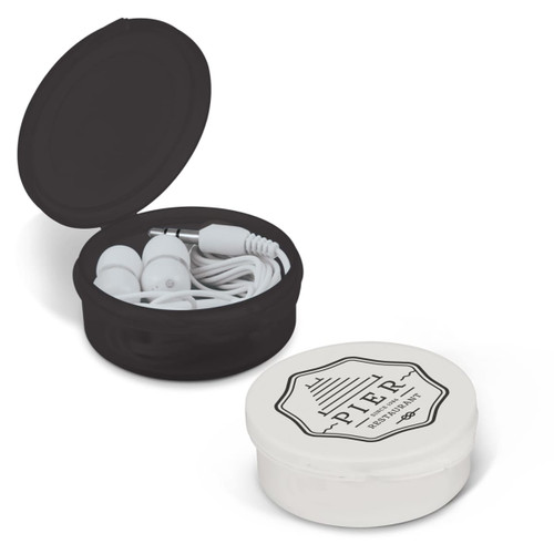 A black and white round case contains white earbuds and a headphone cable, featuring a branding logo on the lid.