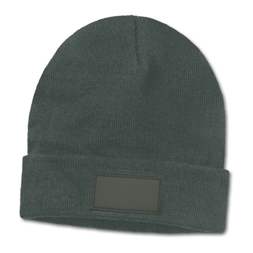 A green beanie with a folded cuff and a blank patch for customization.