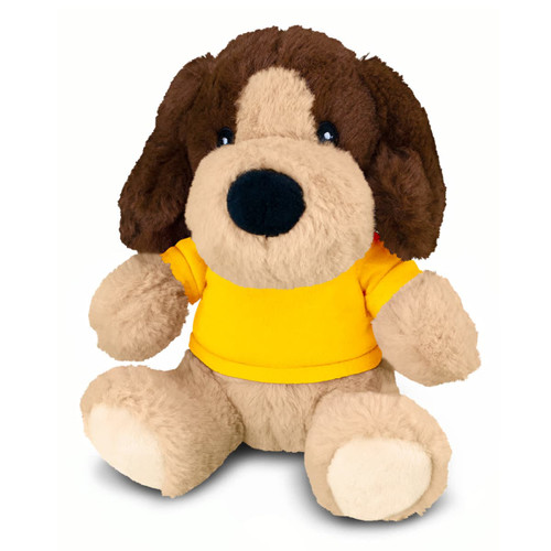 A brown and beige plush dog toy, wearing a yellow shirt, with large eyes and floppy ears. It has a branded tag.