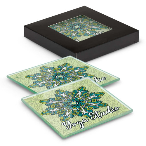A set of two square glass coasters in green with a floral design, packaged in a black box.
