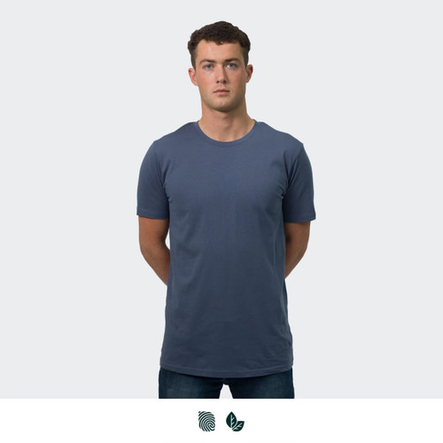 A plain navy blue men's t-shirt with a round neckline, worn by a model standing upright. Features a logo.