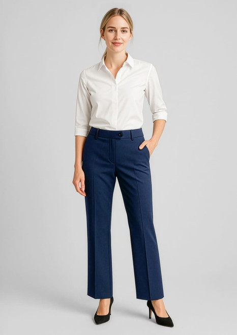 Women's wool stretch adjustable waist pants in navy, paired with a white shirt, featuring a front pocket and slight flare.
