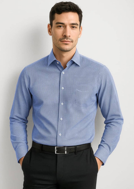 A men’s long sleeve button-up shirt in light blue, featuring a chest pocket and a logo.