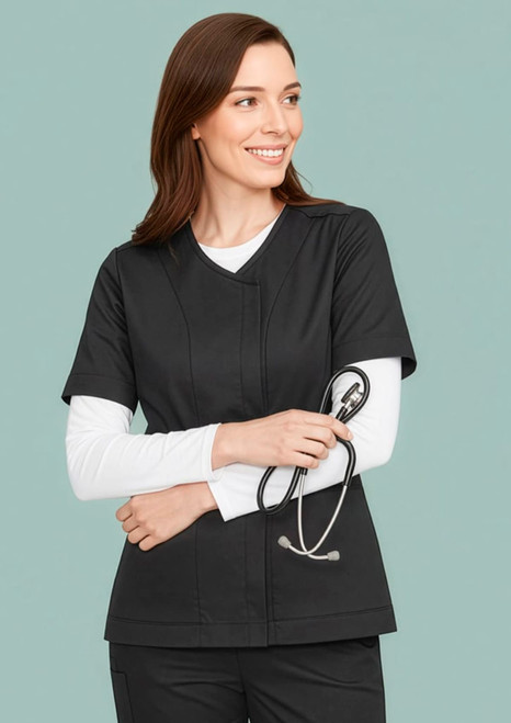 A women's black zip front crossover scrub top with a v-neckline. Includes a logo and features a model holding a stethoscope.