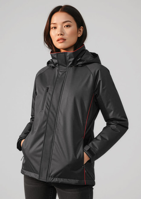 A black unisex jacket with a hood, featuring red detailing and a zippered front, displayed on a model.