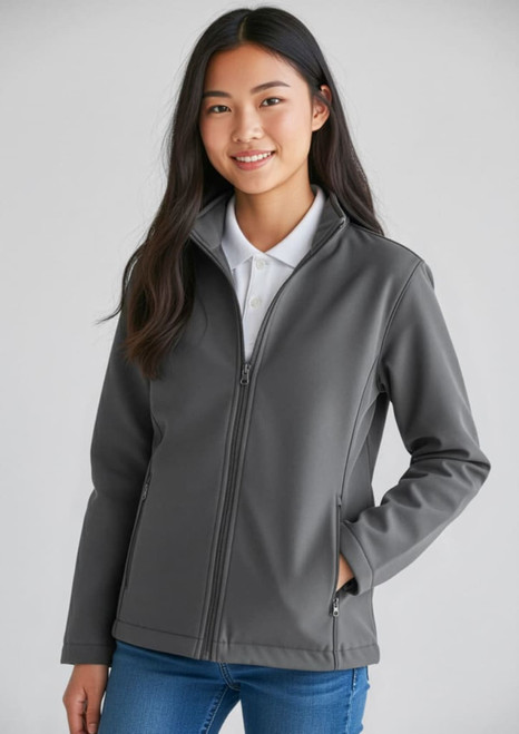 A grey Kids Apex Jacket featuring a front zip and a stand-up collar, modelled by a smiling young person.