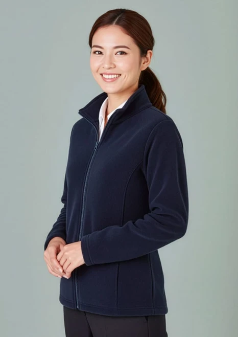 A women's plain micro fleece jacket in navy blue, featuring a zip front and a high collar, displayed on a model.