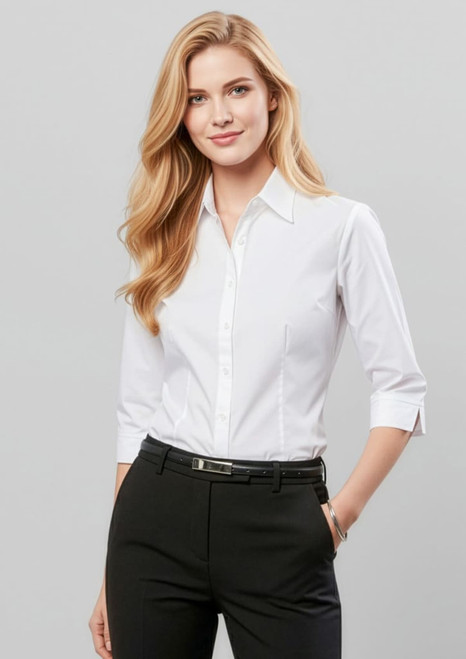 A fitted women's white 3/4 sleeve button-up shirt with a pocket, styled with black pants.