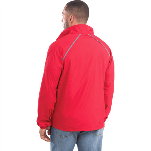 A man wearing a red packable jacket, viewed from the back, featuring a logo and reflective detailing.