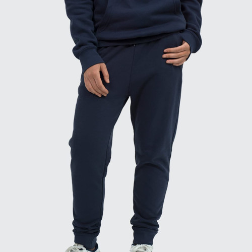 Unisex navy sweatpants with a fitted design and side pockets, paired with a matching hoodie.