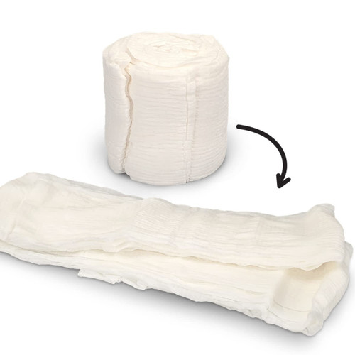 A white compressed towel rolled up and expanded, showcasing its texture and soft, absorbent design.