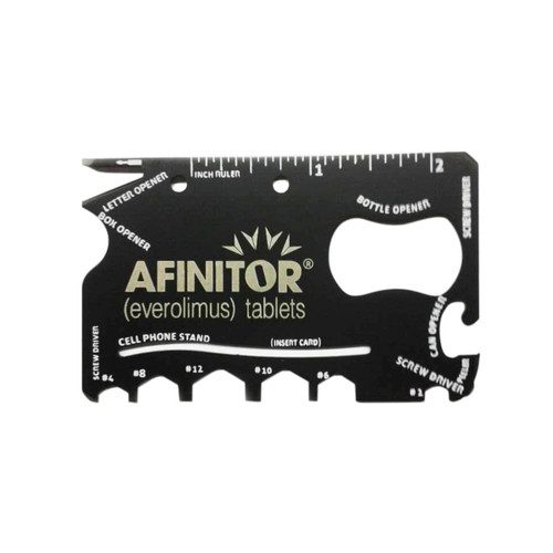 A black card-sized multi-tool with various functions, including a bottle opener and ruler, featuring a logo.