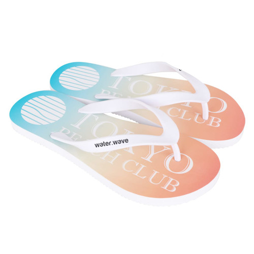 A pair of gradient orange and blue flip flops with white straps and a logo on the footbed.