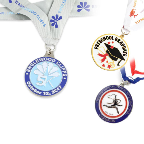 Three custom medals, featuring blue, gold, and silver colours, each with unique designs and ribbons.