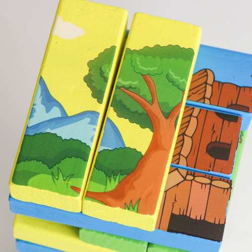 A colourful Sublimation Block Tower featuring vibrant scenes of trees, mountains, and a wooden texture design.