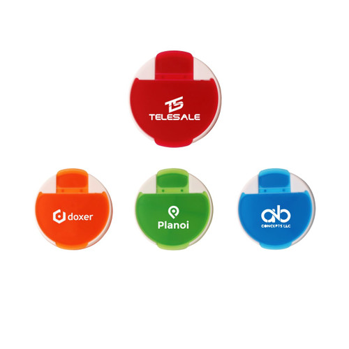 A round pill box featuring four compartments in red, orange, green, and blue. Each section has a clip closure and branding.