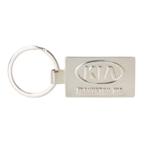 A silver die-struck keyring with a rectangular shape and a logo on one side, attached to a metal ring.
