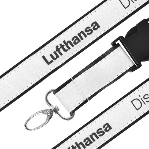 A detailed woven lanyard featuring black and white colours with a clip for attachments and a logo.