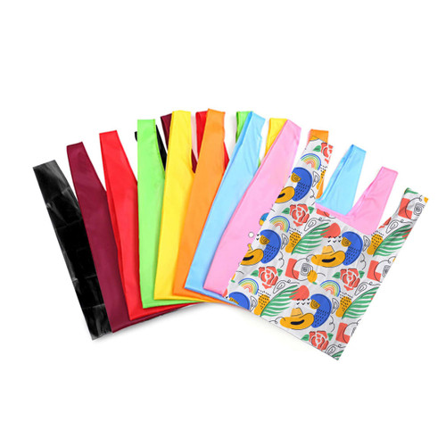 A collection of reusable foldaway shopping bags in various colours including pink, green, orange, red, and a patterned design.