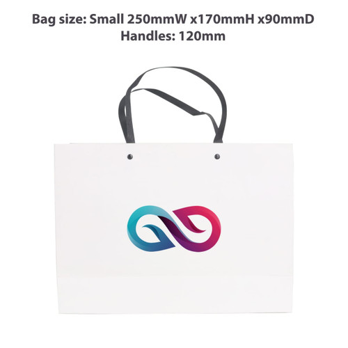 A small white paper bag with a knitted black handle, featuring a logo design in gradient pink and blue.