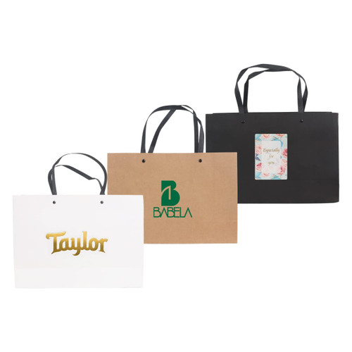 Three small crosswise paper bags with knitted handles: one white, one brown, and one black, each featuring different logos.