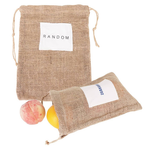 A jute net produce bag in natural brown, containing fruit, with a white label featuring text and a branding logo.
