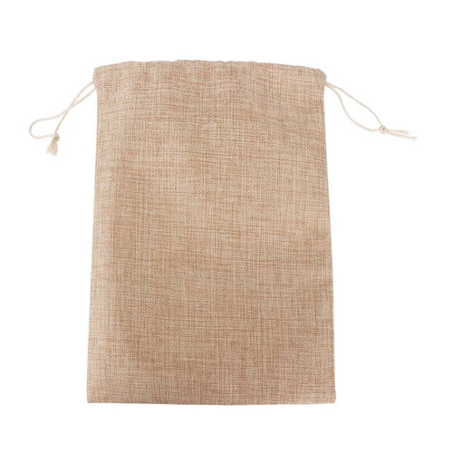 A small jute produce bag in a natural beige colour with drawstring closure and a textured fabric.