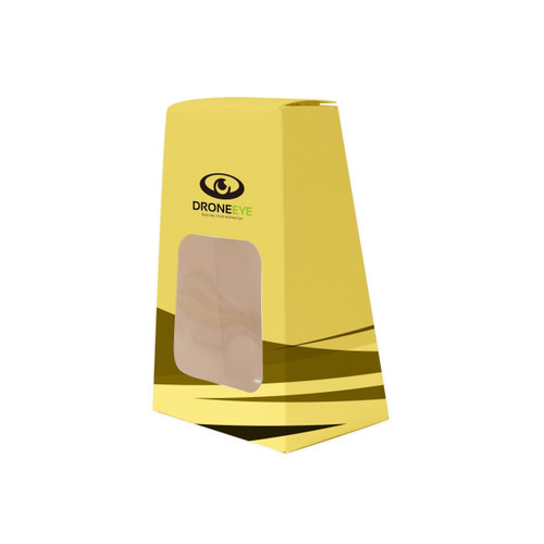 A yellow trapezoidal box with a clear window and a logo, designed for packaging products.