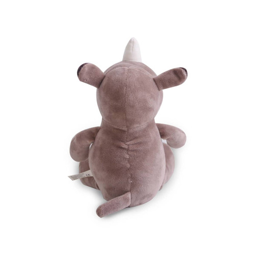 A grey rhinoceros plush toy with a white horn, sitting upright and facing away from the viewer.